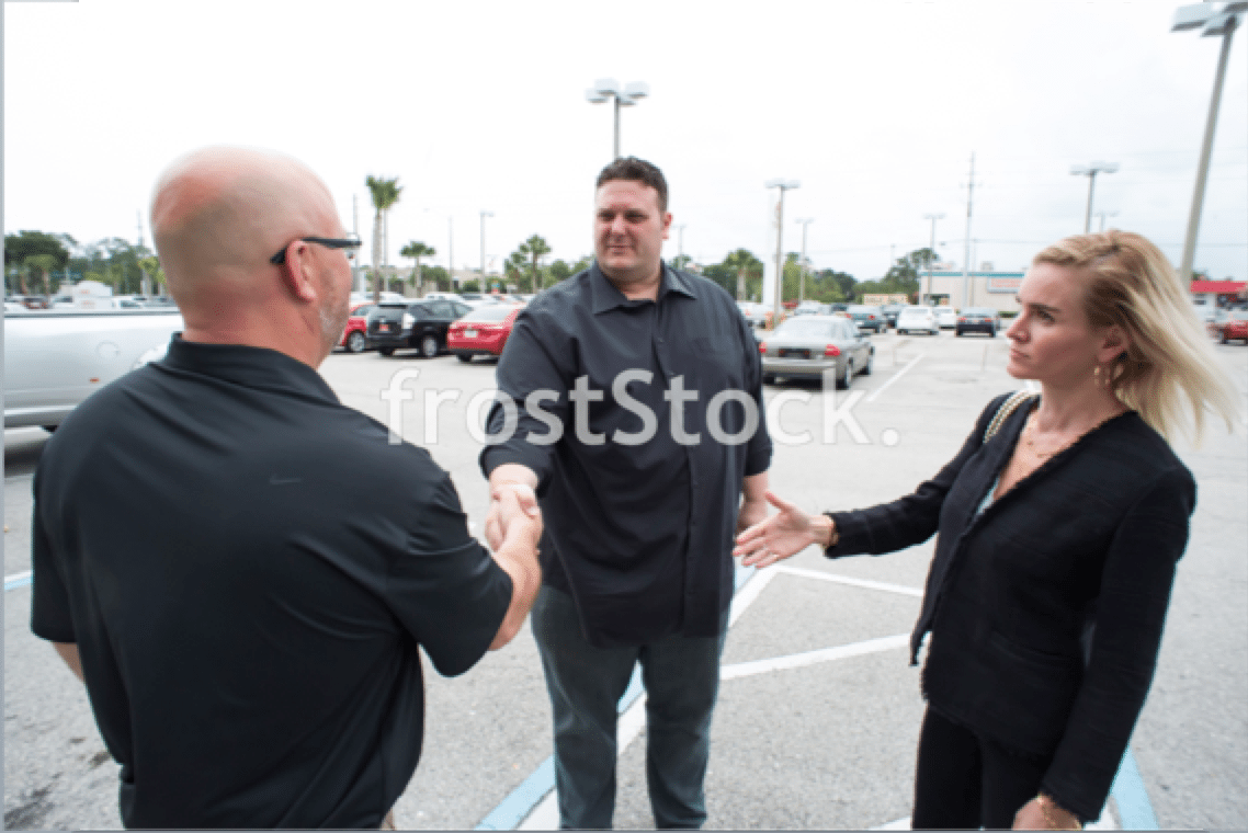 car buying stock photo handshake