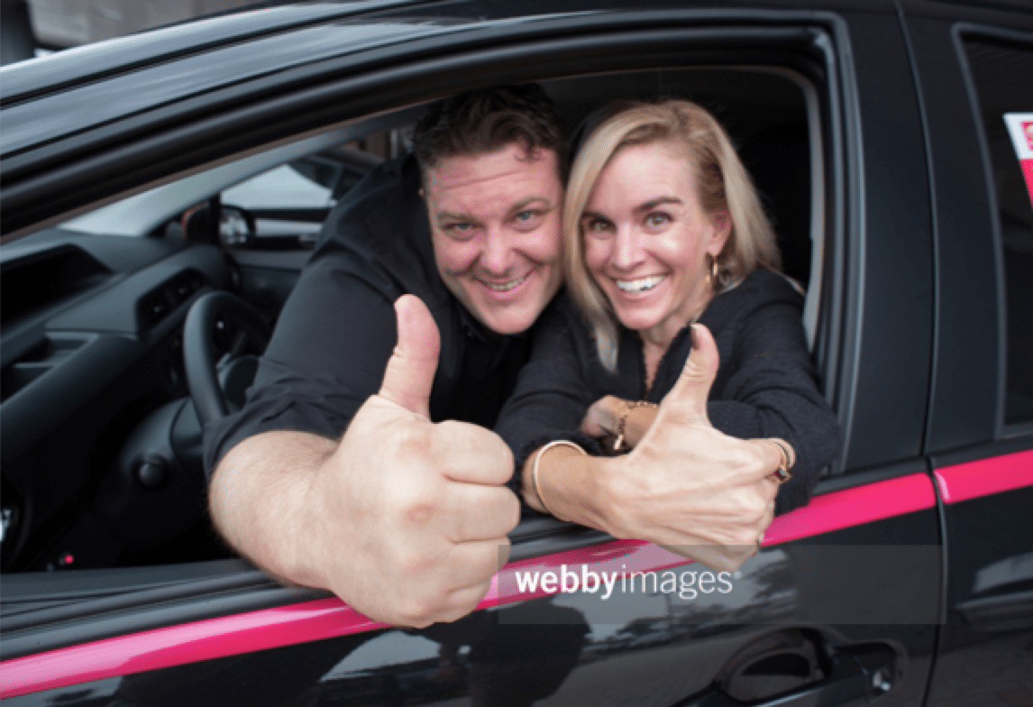 Happy Customers in a New Car Stock Photo