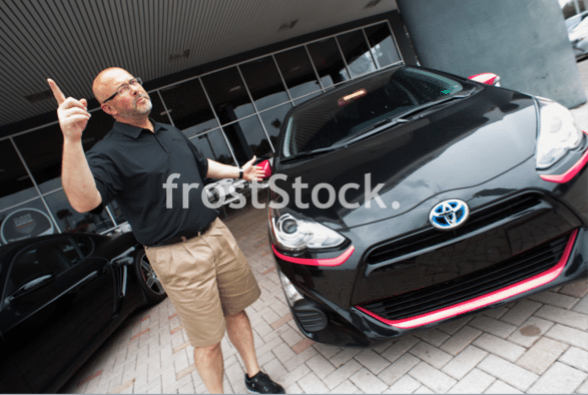 car salesman stock photo